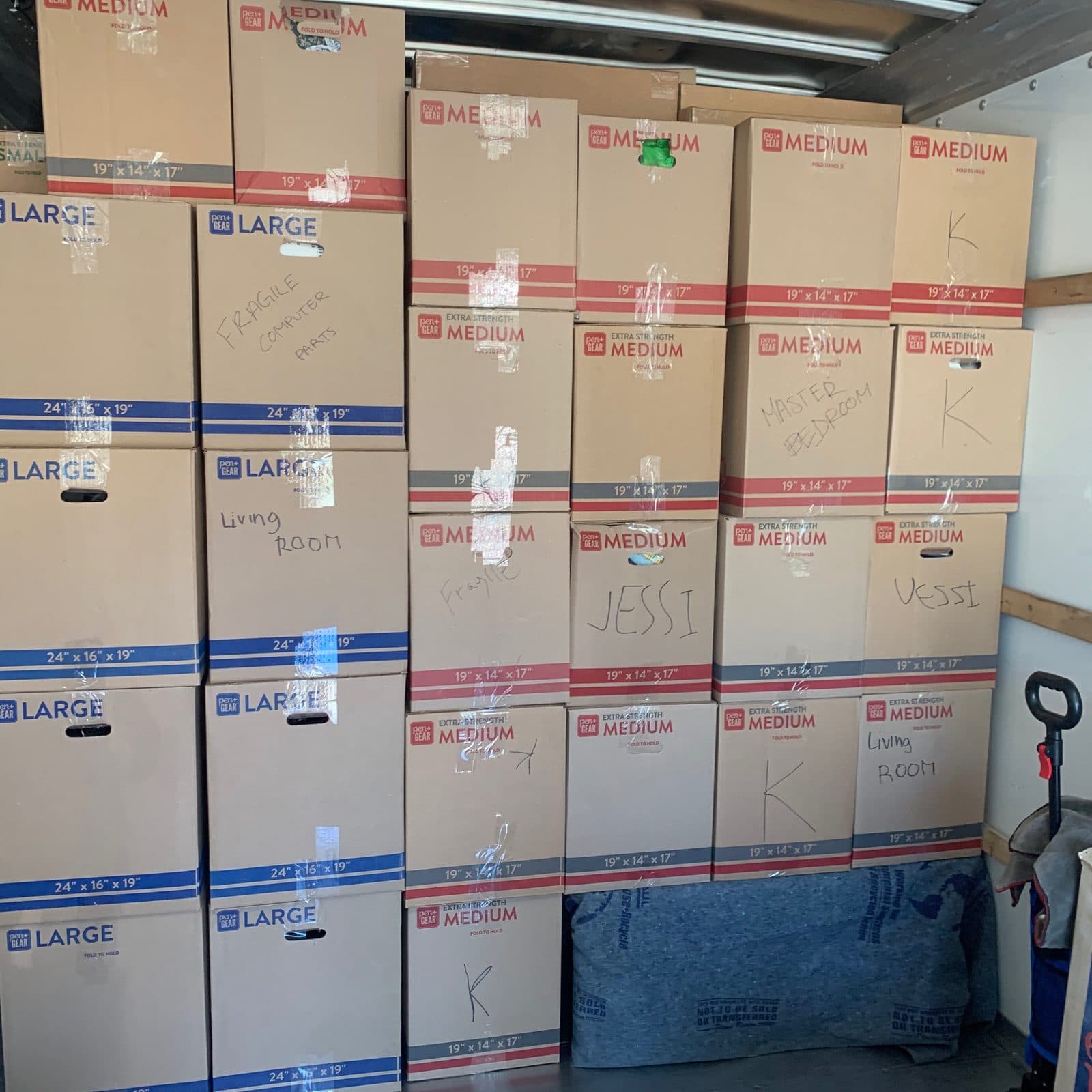 WALL OF LABELED MOVING BOXES